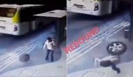 Shocking Footage: Loose Car Tyre Strikes Woman on the Rebound